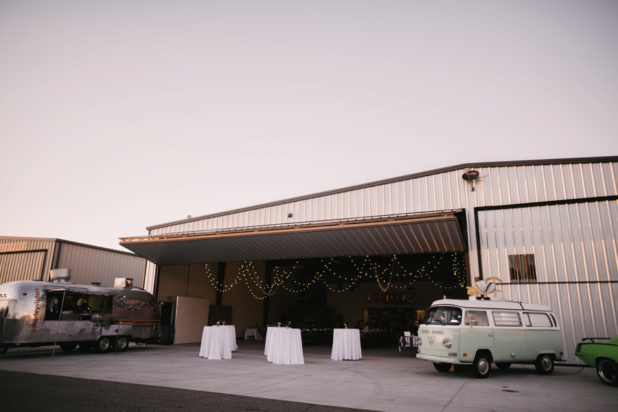 alternative modern industrial outdoor airplane hangar wedding_0078