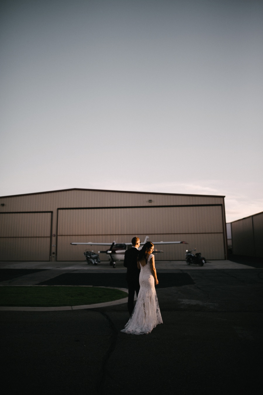 alternative modern industrial outdoor airplane hangar wedding_0114