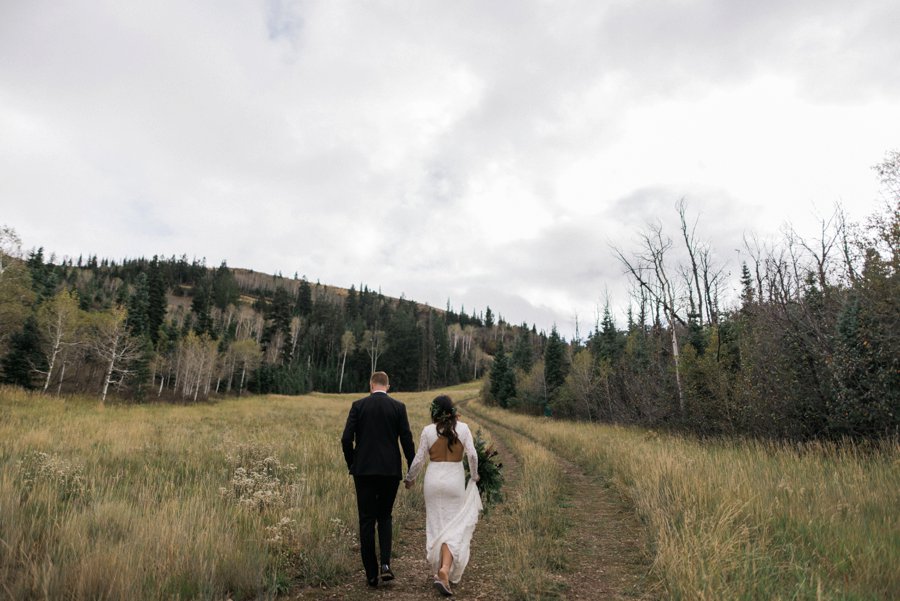 Bride and Groom walking on the trail behind the St Regis Deer Valley