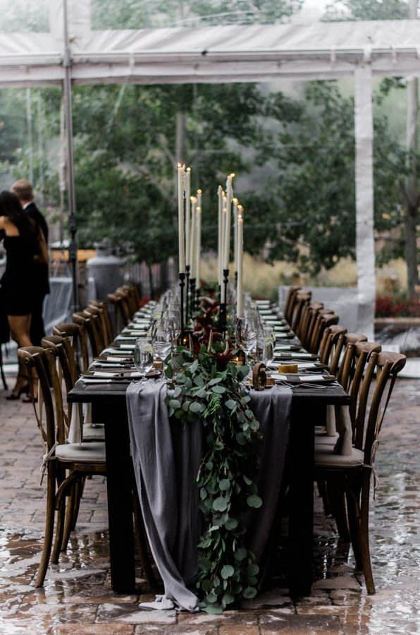 Moody winter wedding table with extra tall candles at the St Regis Deer Valley