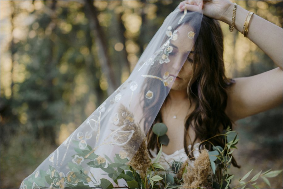 Bride in gold hand-painted BHLDN veil